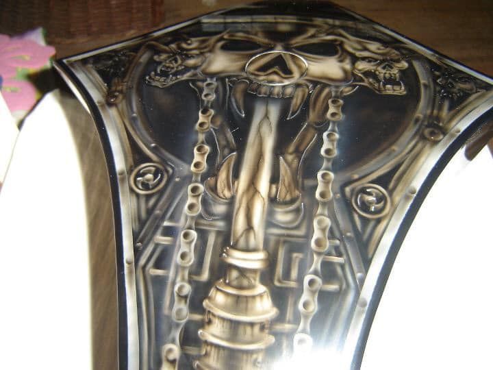 A close up of a ring with a skull on it