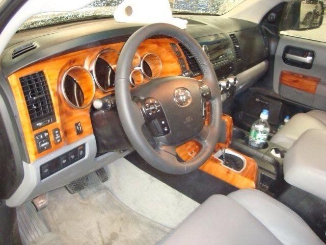 The interior of a toyota truck with a steering wheel