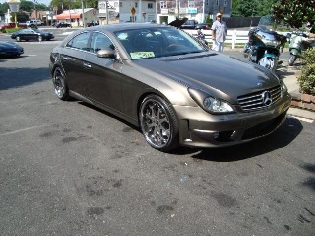 A mercedes benz is parked on the side of the road