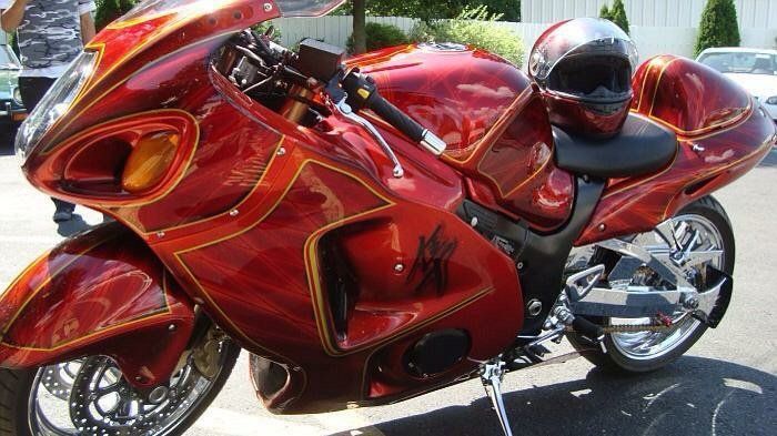 A red motorcycle with a helmet on it