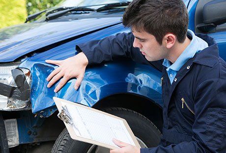 Man Checking the Car Condition — Cambridge, MD — Jess Jr's & Sons Body Shop