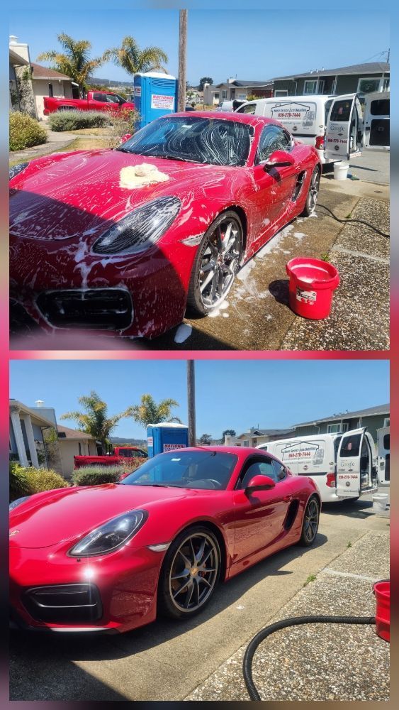 Red Porsche being washed; soapy and clean, with mobile detailing van and equipment visible.