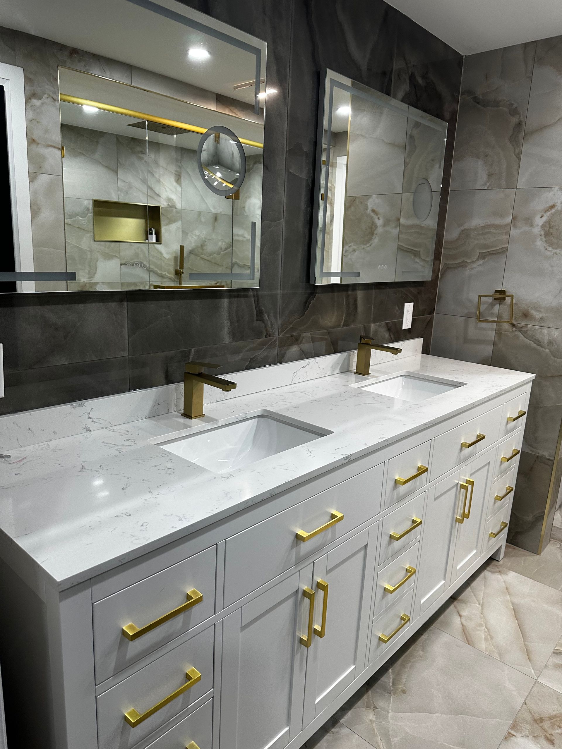 A bathroom with two sinks and two mirrors.