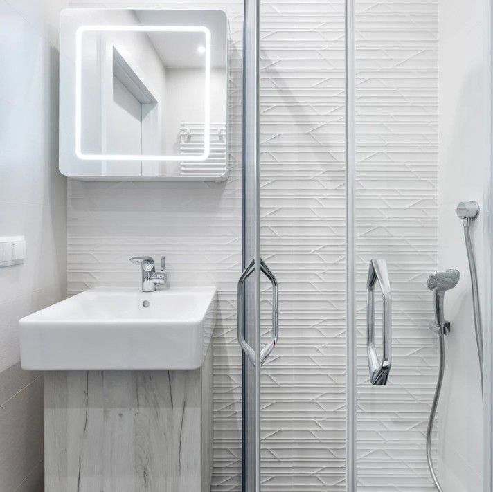 Derbyshire Specialists Group cloakroom conversion to a shower room with sink in Derbyshire