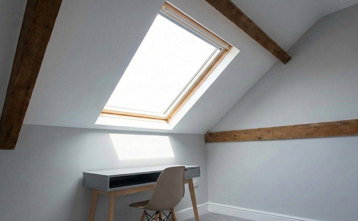 Derbyshire Specialists Group completed loft conversion, transformed into a bright study with a large Velux window and exposed beams.