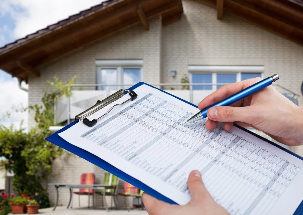 Derbyshire Specialists Group carrying out a property management inspection on the outside of a property in Derby