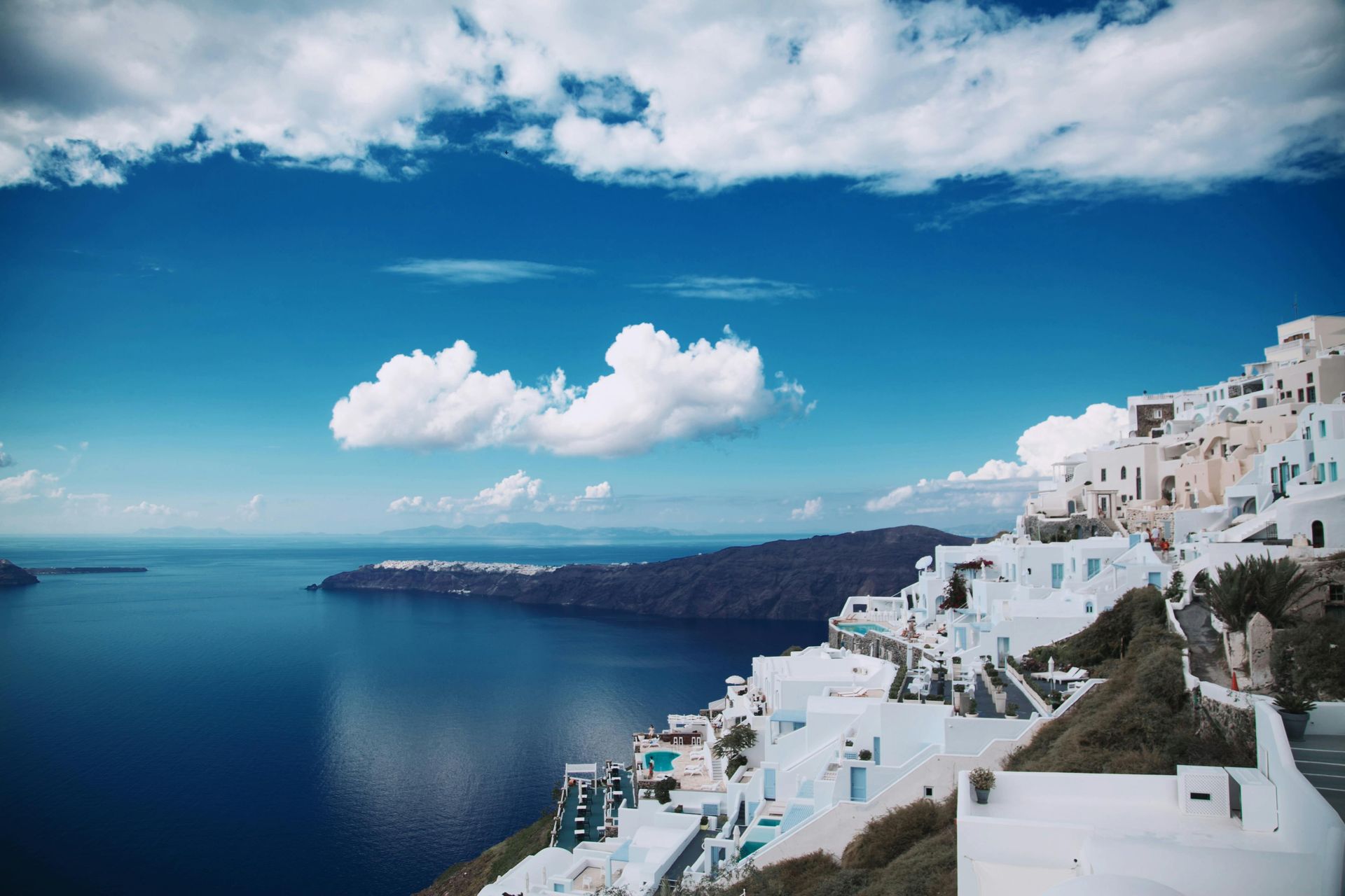 A picture showing Santorini and tourism