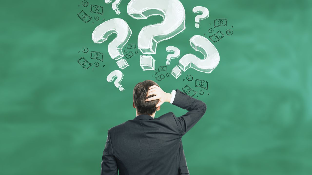 man with head on his head thinking and how it costs money to not have a clear plan of action