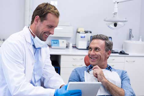 Dental Crowns — Happy Dentist and Patient in Whiting, IN
