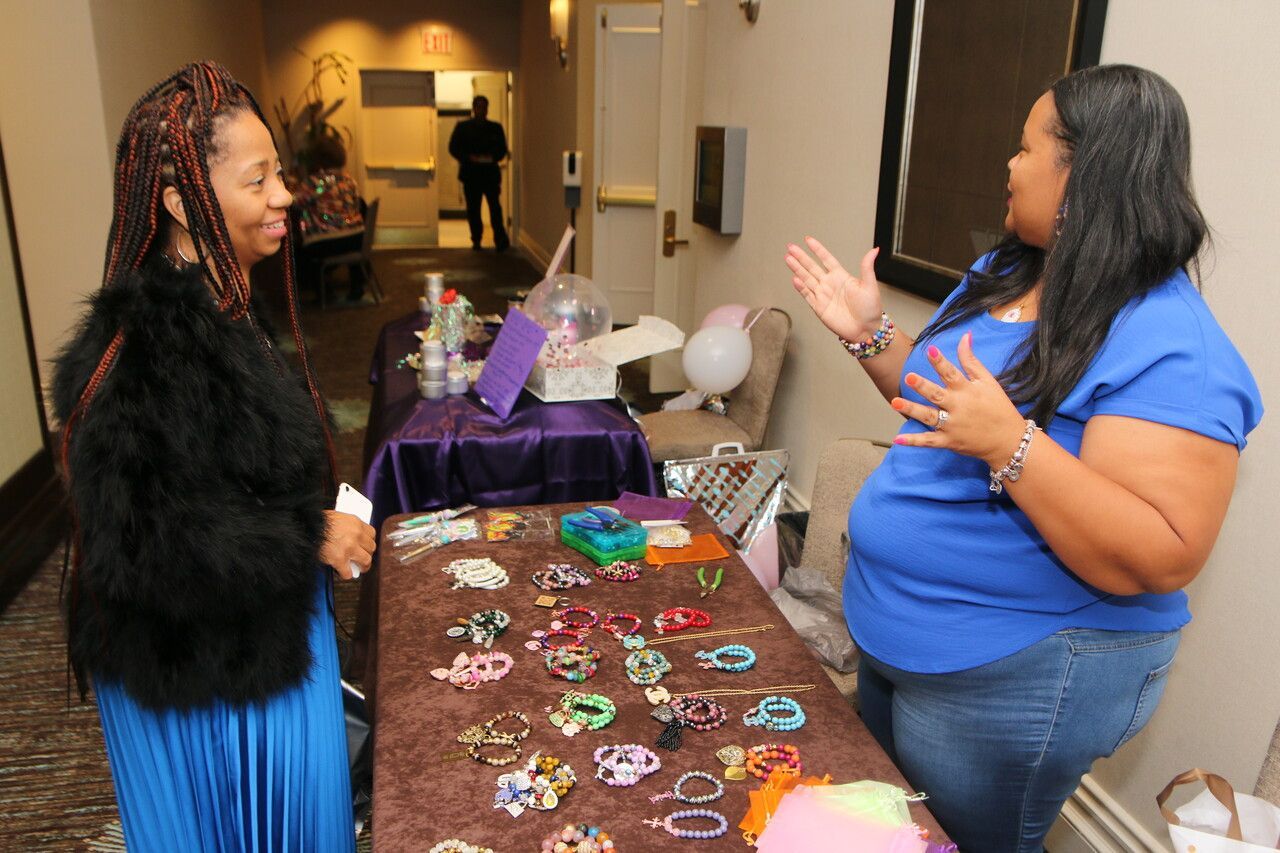 Two lady members talking at an event at Overflow Christian Center