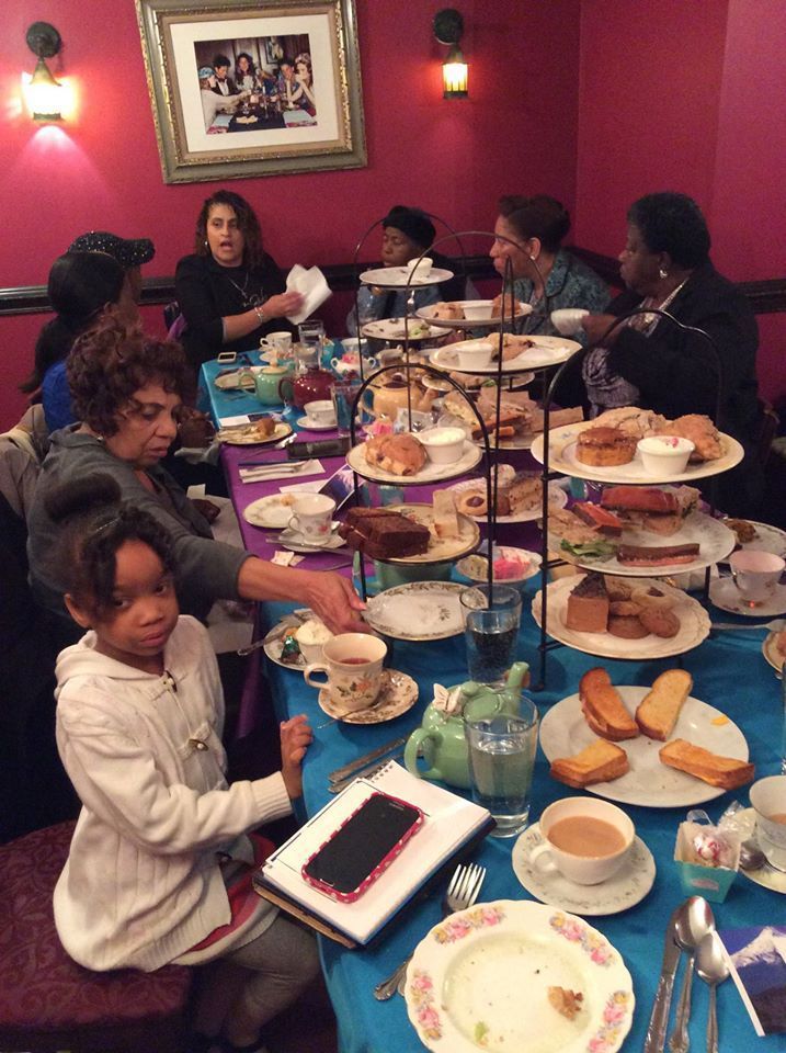 Photo of some members of Women's Ministry eating at an event at Overflow Christian Center