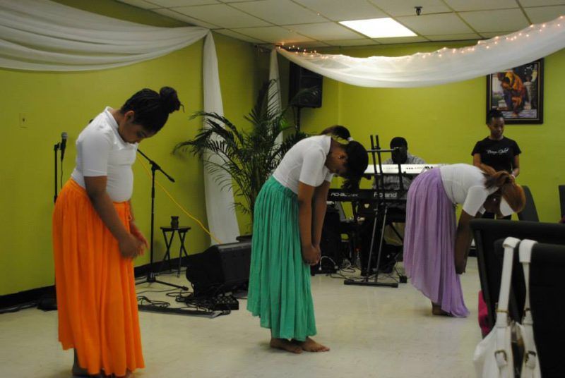 Teen girls having a presentation at an event at Overflow Christian Center