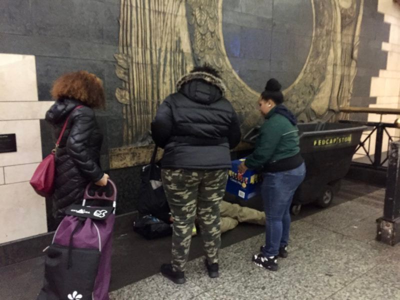 Photo of some church members checking on something