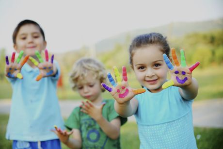 Three children with paint on hands, After School Program Spring Lake, NC