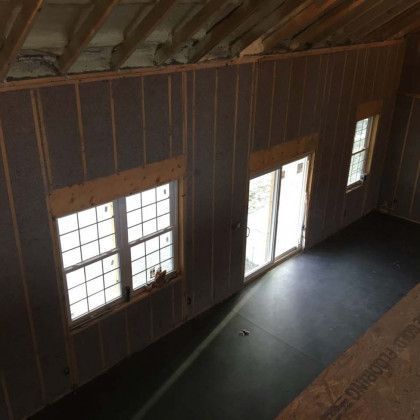 An aerial view of a room with a lot of windows