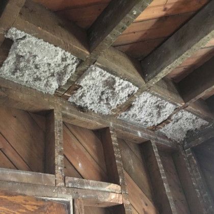 A ceiling with a lot of wood and styrofoam