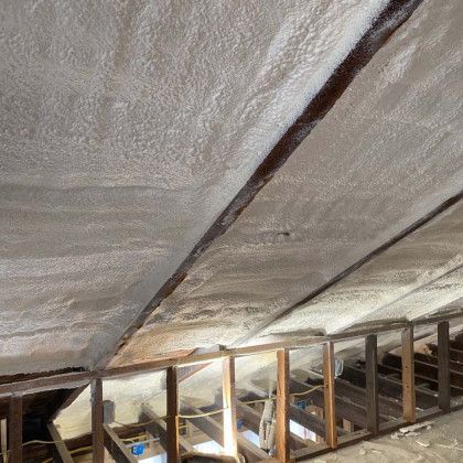 A ceiling with a lot of spray foam on it.