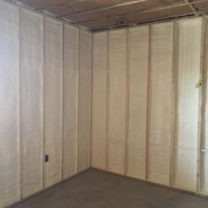 A room with foam insulation on the walls and ceiling.