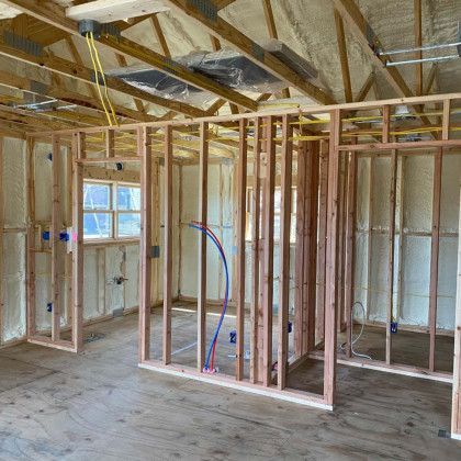 A room in a house that is being built with a lot of insulation on the walls.