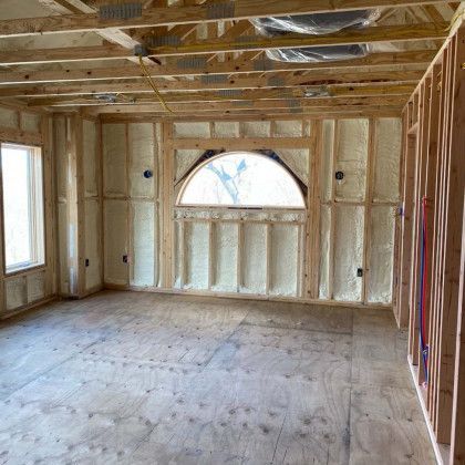 A room with a window and a lot of insulation on the walls.