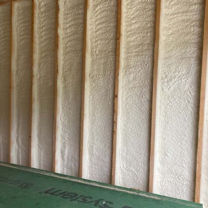 A wall with a lot of spray foam on it.