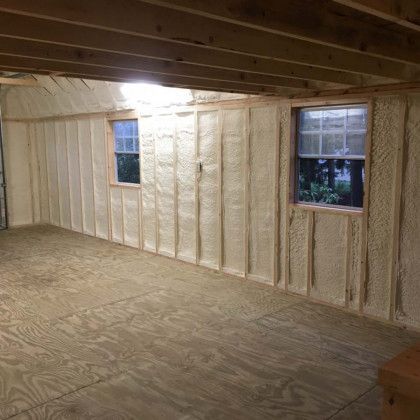 A room with a lot of insulation on the walls and a window.