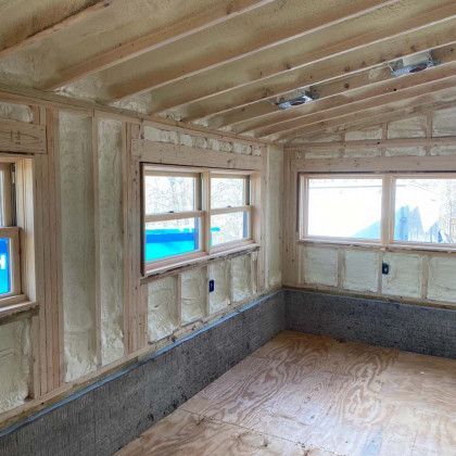 A room with a lot of windows and foam on the walls.