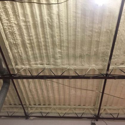 The ceiling of a building with a lot of foam on it.