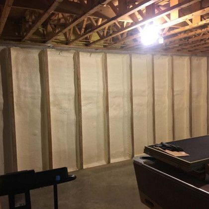 A basement with a pool table and a pool table.