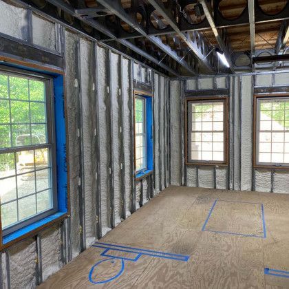 A room with a lot of windows and foam on the walls.