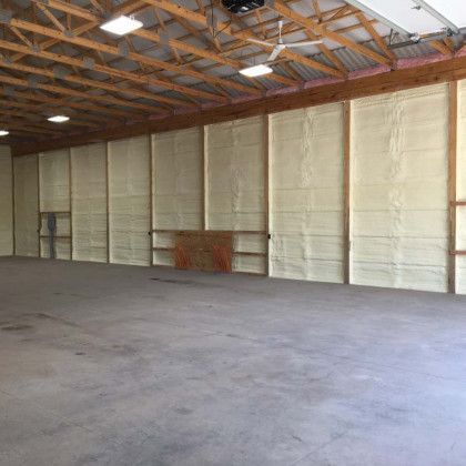 A large warehouse with a lot of insulation on the walls and ceiling.