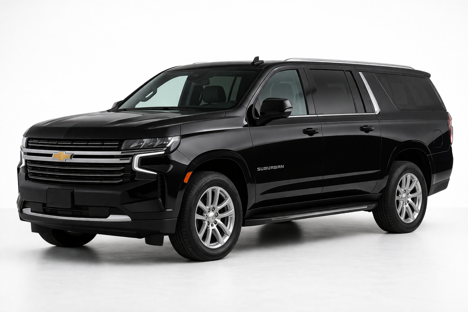 A shiny black Chevrolet Suburban SUV parked against a plain white background.