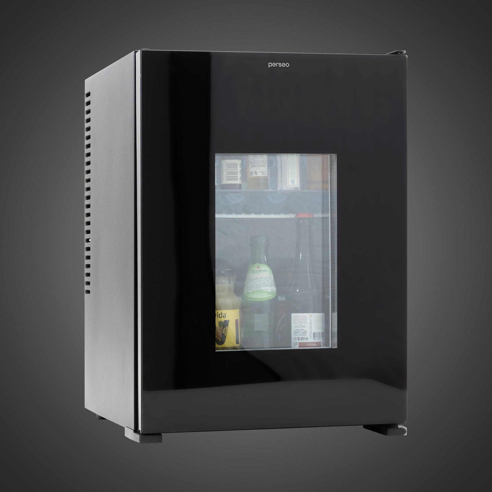 Small black glass-door mini fridge with drinks inside, shown in a side view.