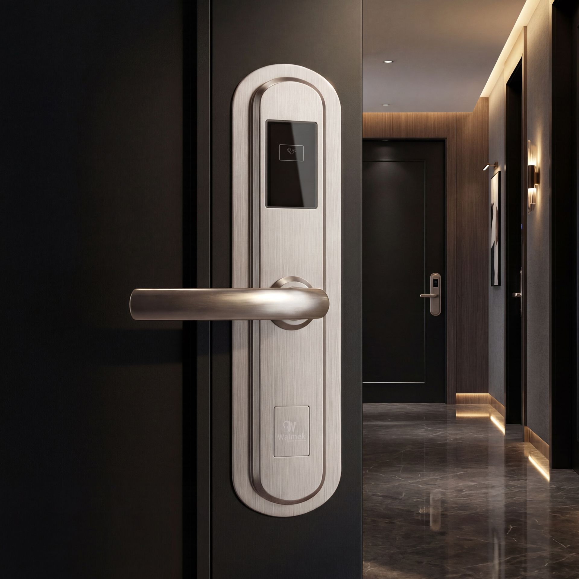 A sleek, brushed silver electronic hotel door lock with an integrated key card reader mounted on a black door in a hallway.