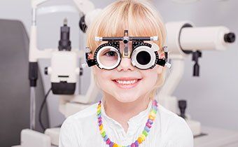 Little Girl Checking her Vision - Eye Exams in Gallup, NM