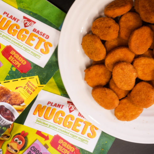 Plate of vegan nuggets with Alpha Foods packaging