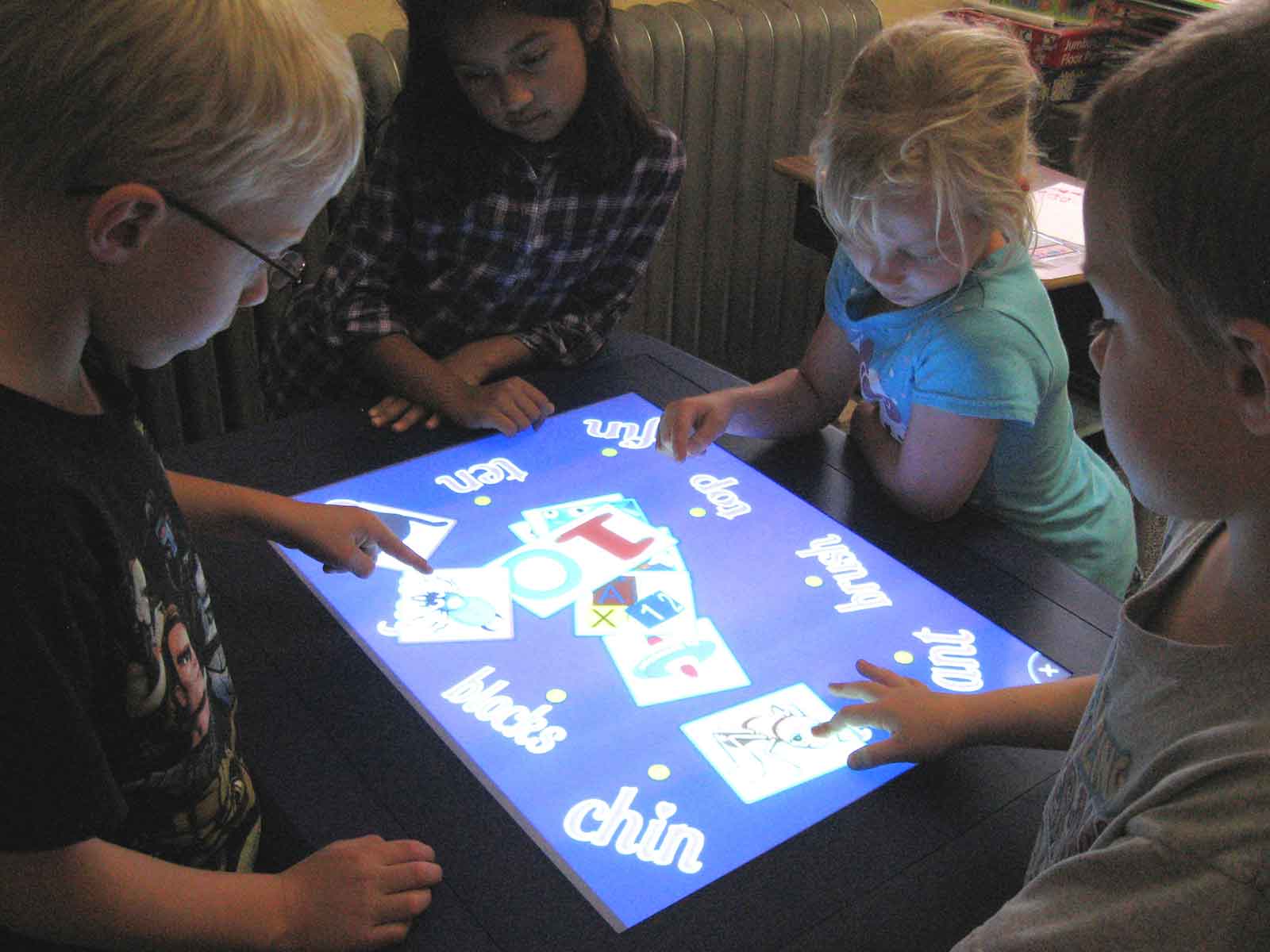 Children using a touch screen product to learn interactively