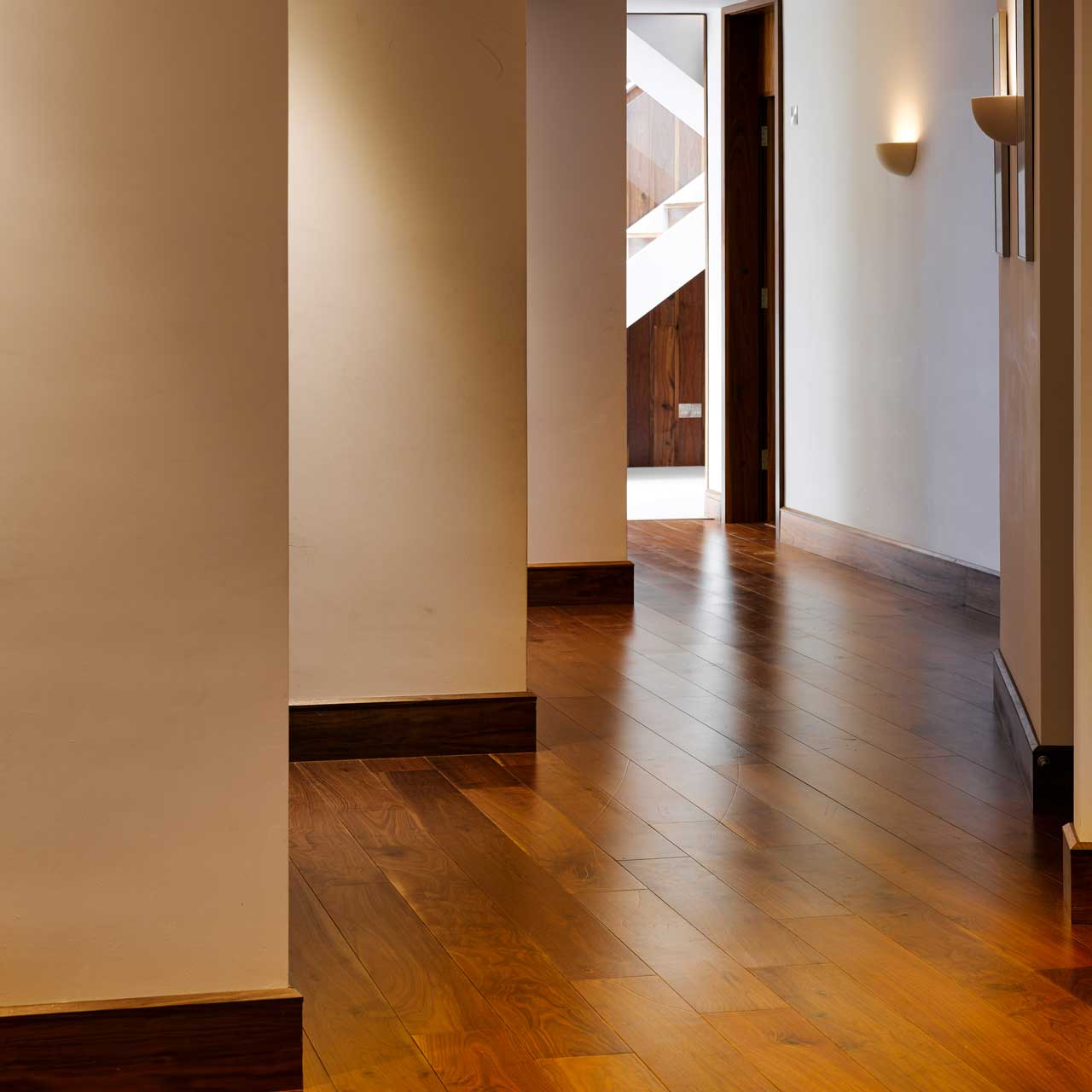 Galtee Lodge's hallway with a wooden floor designed by Dublin Design Studio