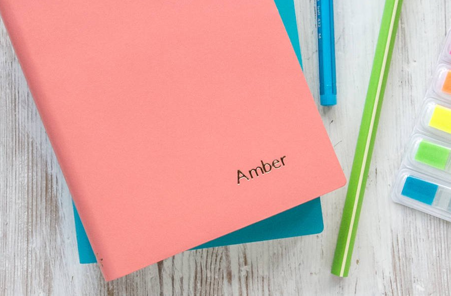 A pink personalized notebook by Not on the High Street