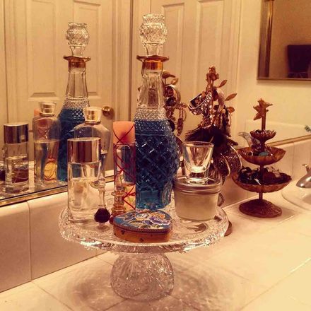 Display of glass thrift-store decanter.