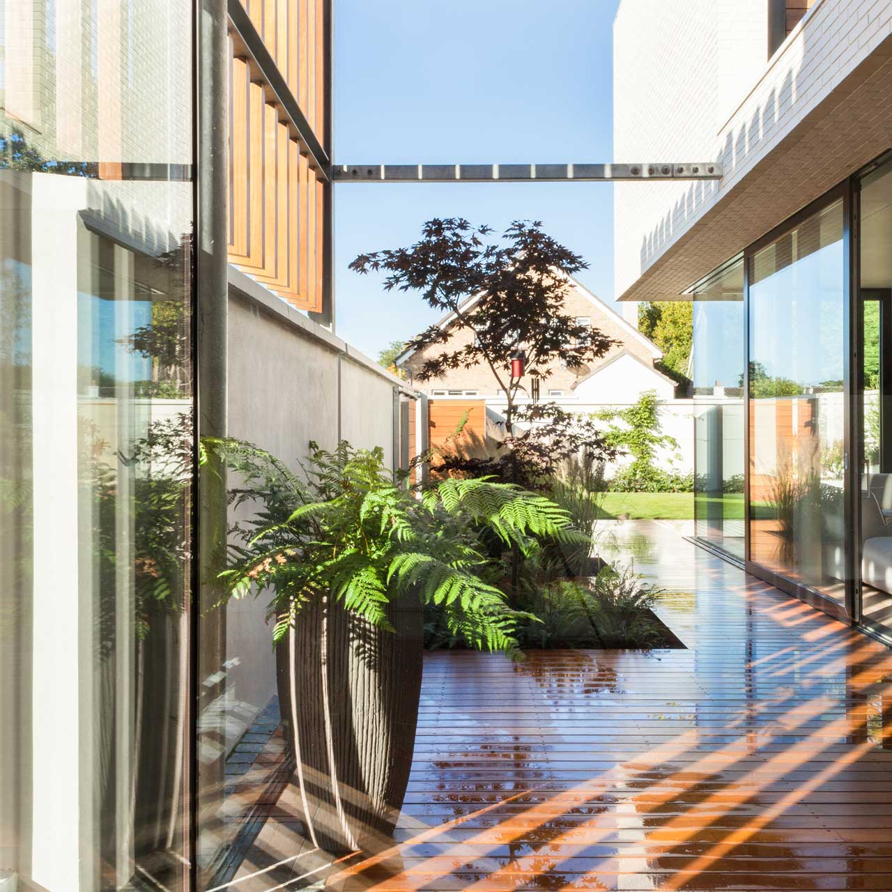 Large sliding doors enhance the connection with the exterior at the new house in Clontarf, Dublin
