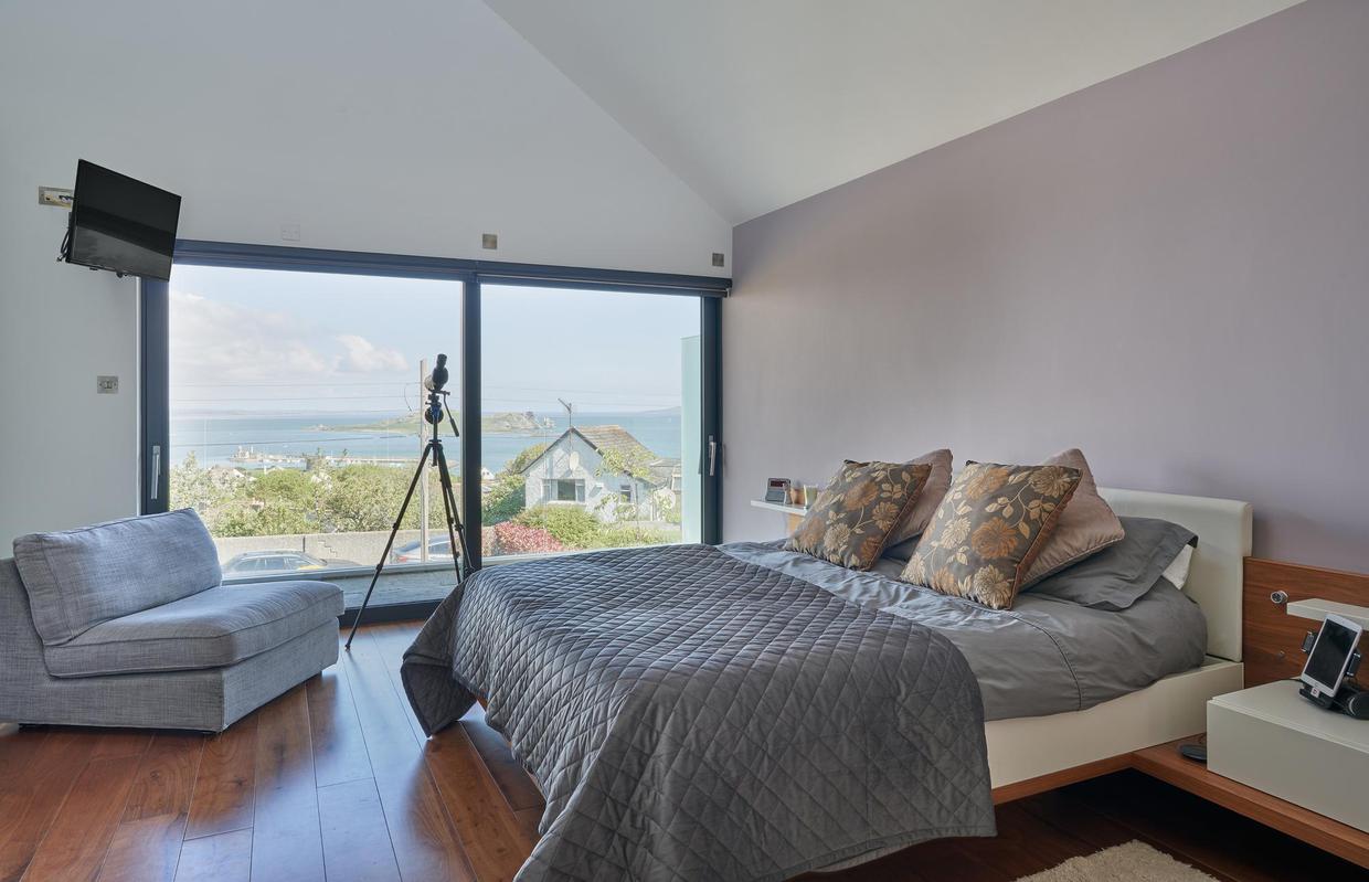 Double-height master bedroom suite with access to its own private terrace.