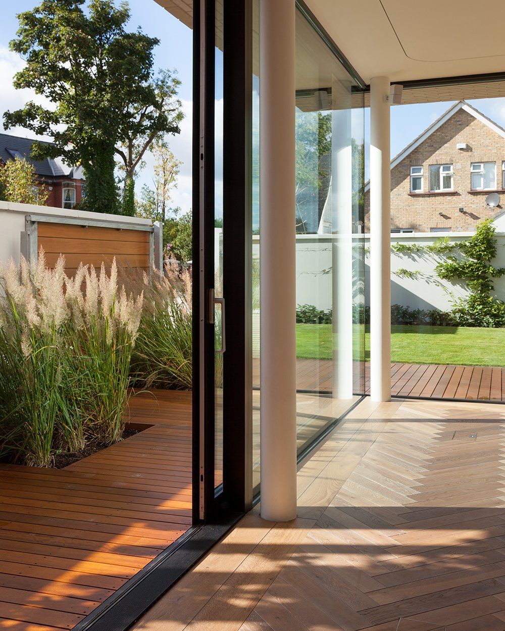 Large sliding doors enhance the connection with the exterior at the new house in Clontarf, Dublin