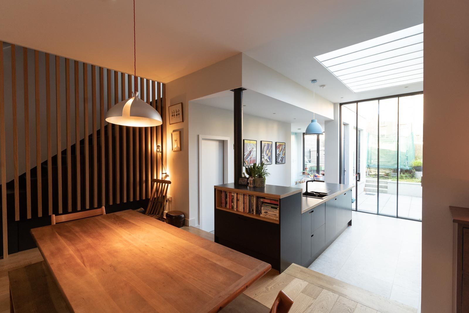 The feature rooflight with timber fins bring diffused natural light into the kitchen