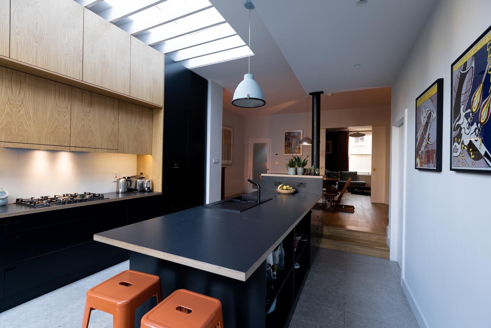The feature rooflight with timber fins bring diffused natural light into the kitchen