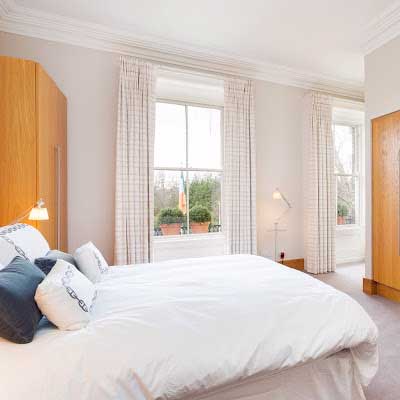 Interior of a master bedroom at Fitzwilliam Tennis Club designed by Dublin Design Studio