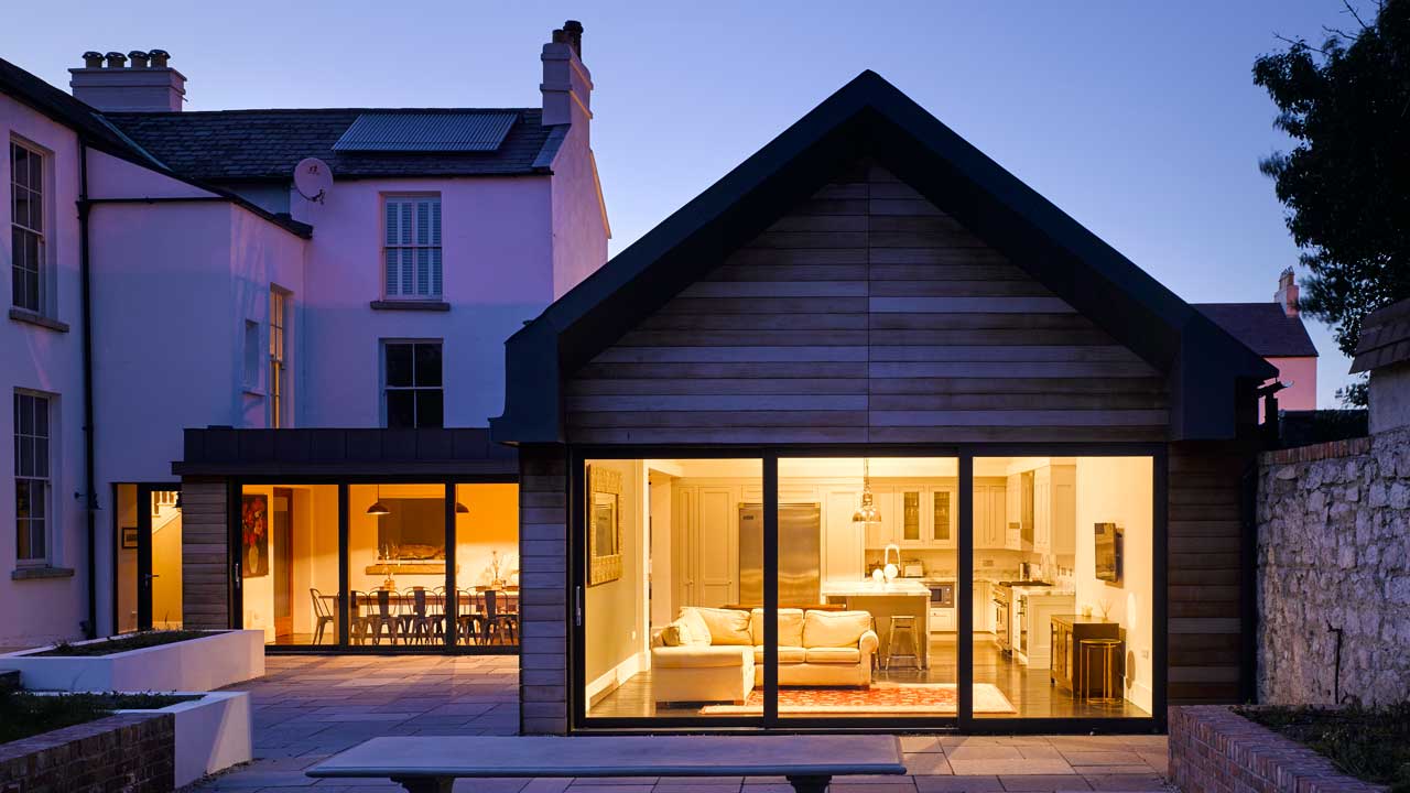 View of the kitchen and living room from the backyard designed by Dublin Design Studio