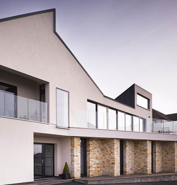 Stone detailing at a sustainable dwelling overlooking Howth harbour