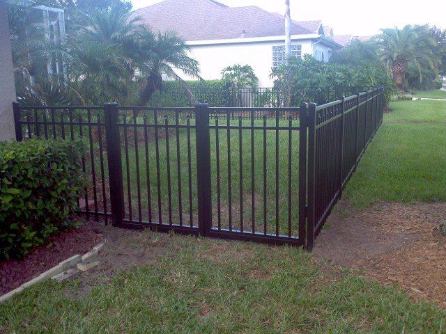 black fence in yard  Fencing Services in New Port Richey, Florida