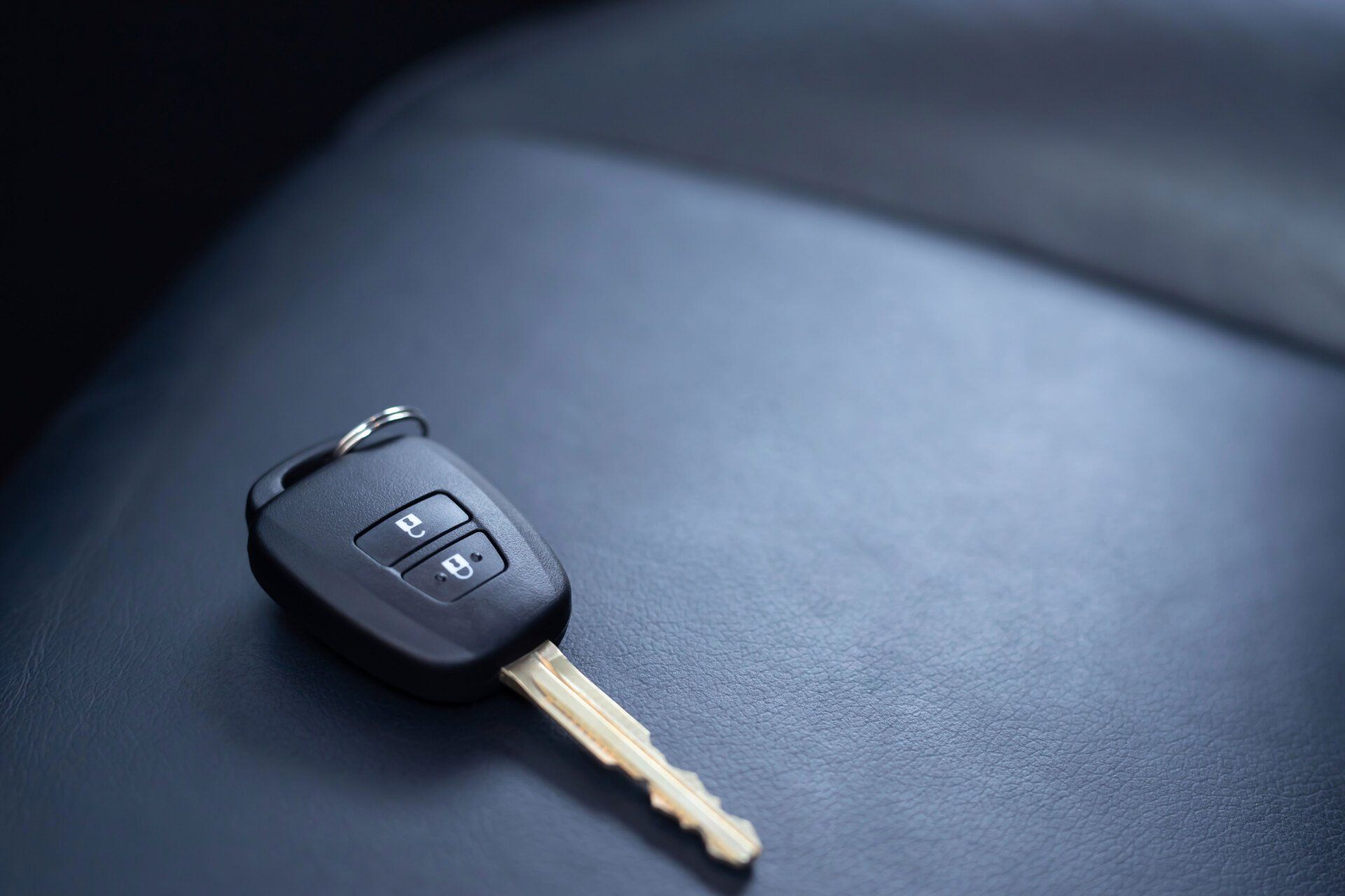 Car key on a leather surface